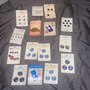 Set of 15 vintage buttons on cards and 3 loose buttons.